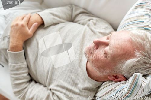 Image of close up of senior man sleeping on sofa