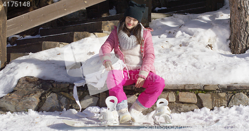 Image of Young woman on skiing holiday