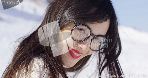 Image of Portrait of brunette woman wearing eyeglasses