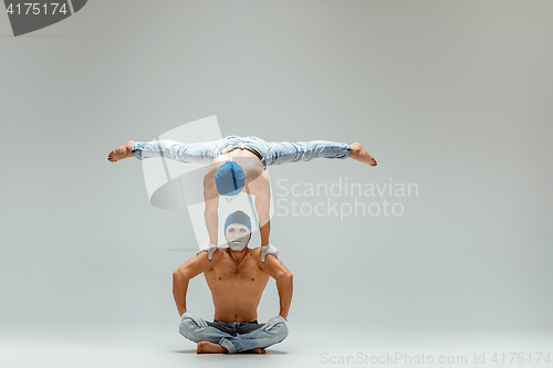 Image of The two gymnastic acrobatic caucasian men on balance pose