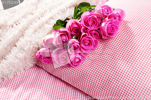 Image of pink roses on pillow