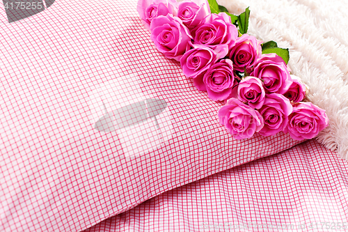Image of pink roses on pillow