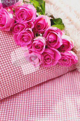 Image of pink roses on pillow