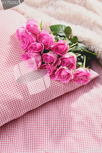 Image of pink roses on pillow