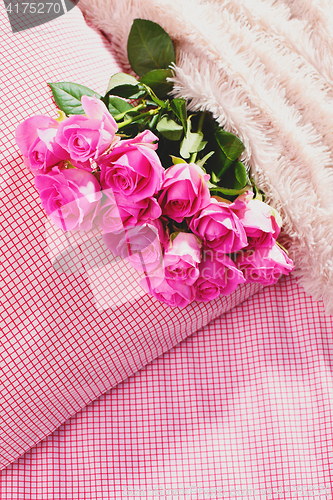 Image of pink roses on pillow