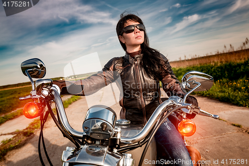 Image of Biker girl on a motorcycle