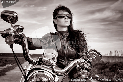 Image of Biker girl on a motorcycle