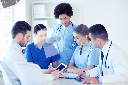 Image of group of doctors with tablet pc at hospital