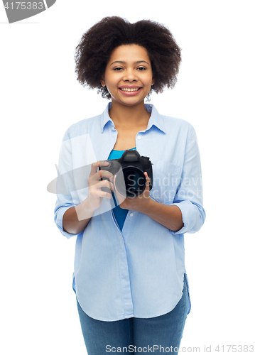 Image of happy african american woman with digital camera