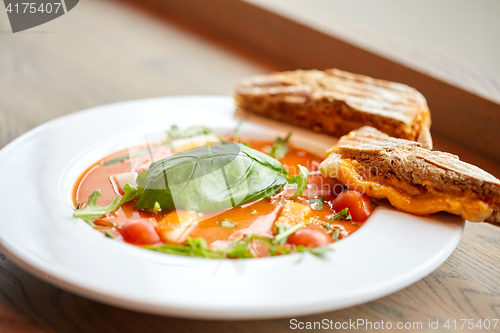 Image of close up of gazpacho soup with bread at restaurant