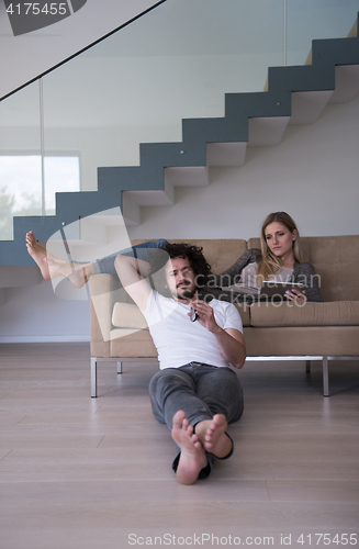 Image of young couple relaxes in the living room