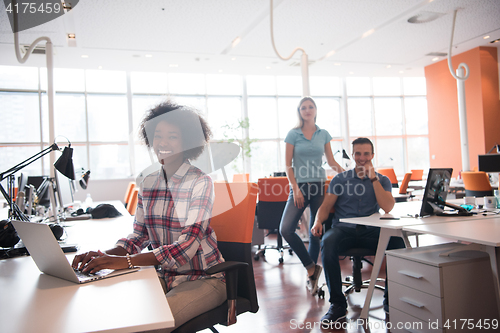 Image of African American informal business woman working in the office
