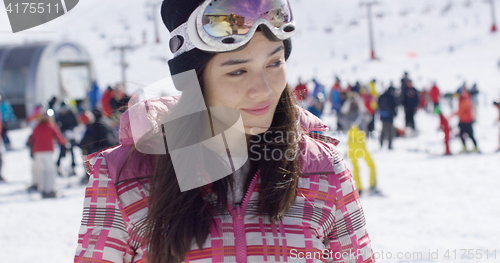 Image of Young woman on skiing holiday