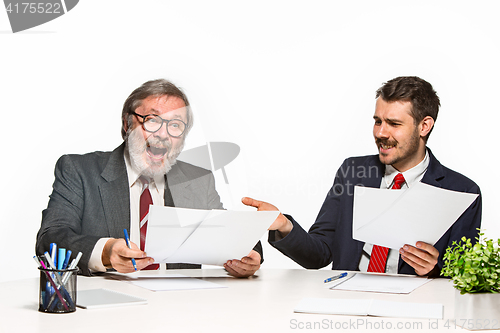 Image of The two colleagues working together at office on white background.