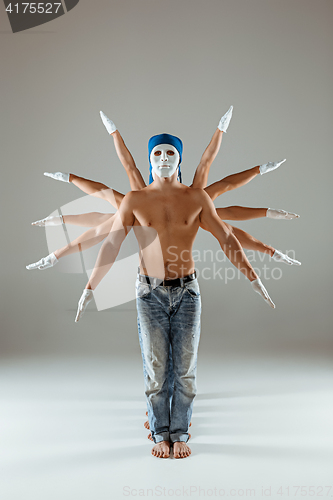 Image of The group of caucasian men in white masks and hats, jeans