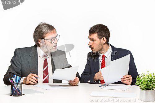 Image of The two colleagues working together at office on white background.