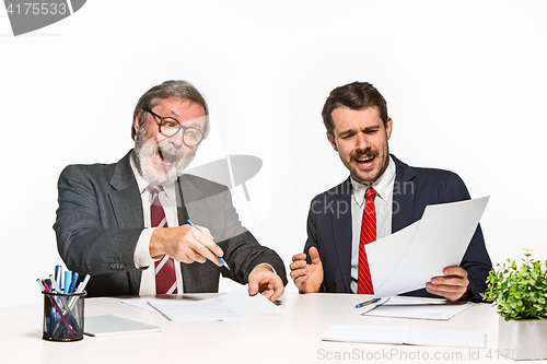 Image of The two colleagues working together at office on white background.