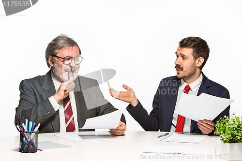 Image of The two colleagues working together at office on white background.