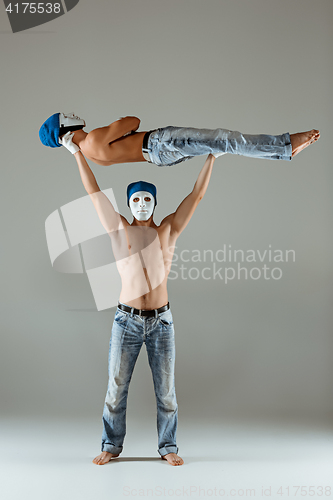 Image of The two gymnastic acrobatic caucasian men on balance pose