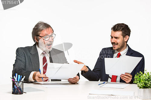 Image of The two colleagues working together at office on white background.