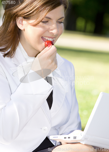 Image of business lady with strawberry