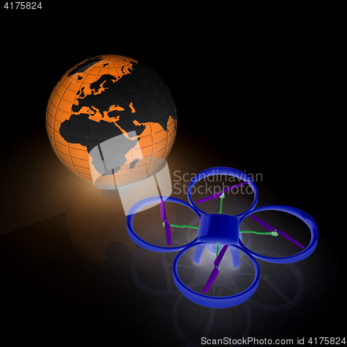 Image of Quadrocopter Drone with Earth Globe and remote controller on a w