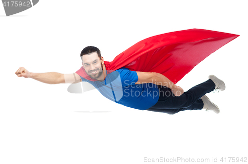 Image of happy man in red superhero cape flying on air