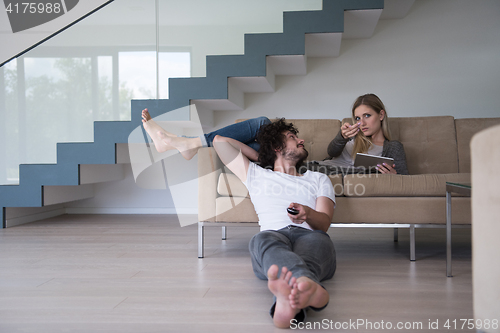 Image of young couple relaxes in the living room