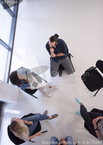 Image of Multiethnic startup business team on meeting  top view