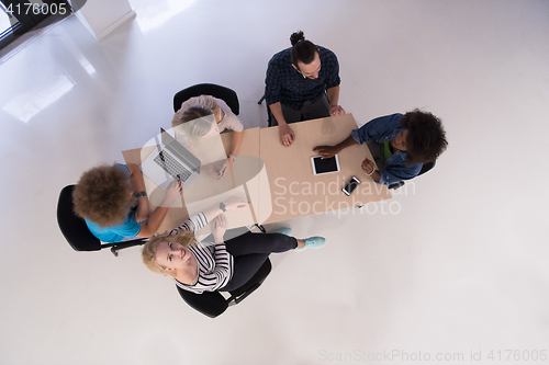 Image of Multiethnic startup business team on meeting  top view