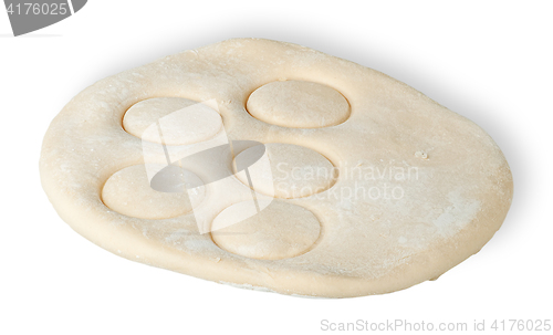 Image of Roll dough with pressed through circles
