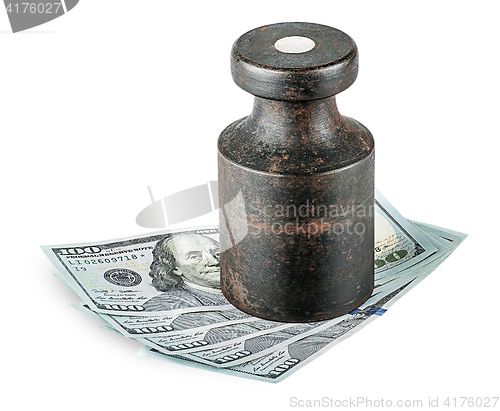 Image of Banknotes clamped old rusty weights
