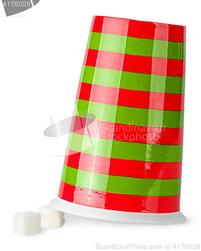 Image of Inverted red and green cup with sugar cubes