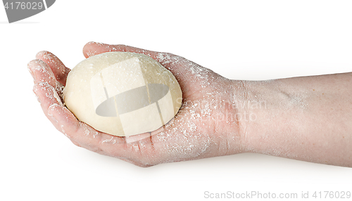 Image of Piece of dough in human hand