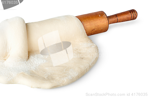 Image of Closeup rolling pin covered with dough