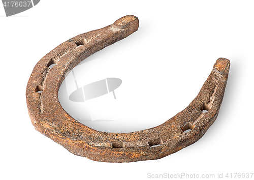 Image of Old rusty horseshoe horizontally