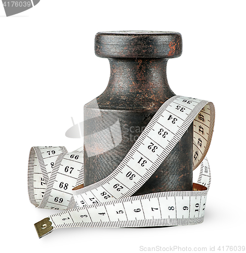 Image of Old rusty weight wrapped centimeter