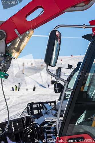 Image of Skiers and snow-grooming machine