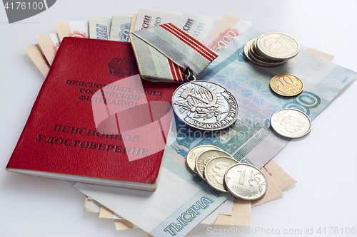 Image of Identity veteran document, pension money and medal of veteran