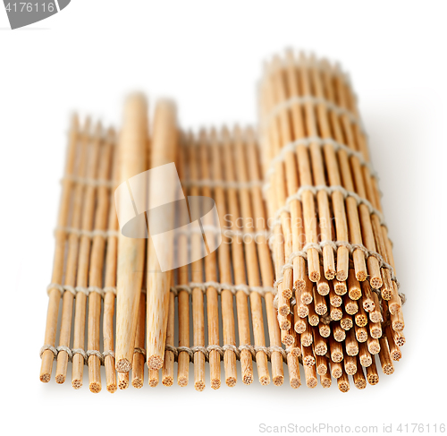 Image of Sushi mat partially deployed and chopsticks perspective