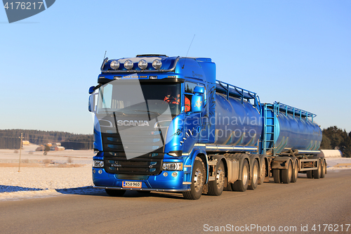 Image of Blue Scania Tank Truck at Speed