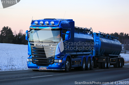 Image of New Blue Scania Tank Truck Trucking in the Winter Twilight