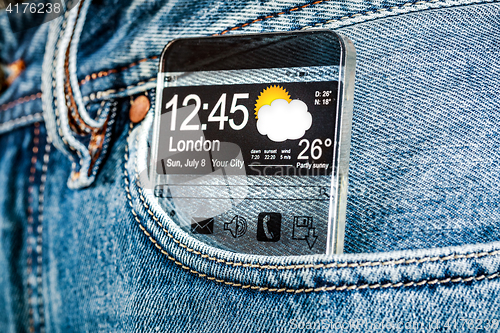 Image of Smartphone with a transparent screen in a pocket of jeans.