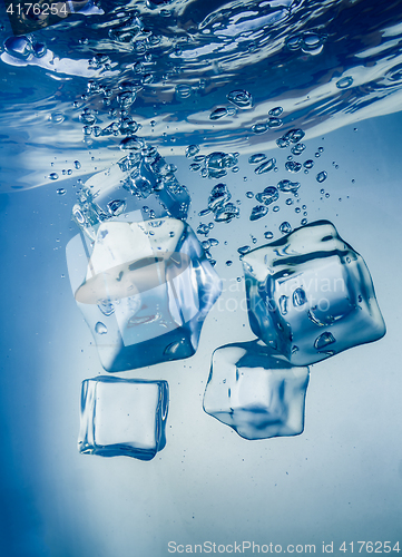 Image of Ice cubes falling under water