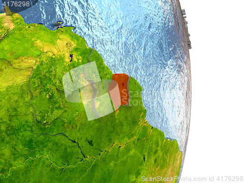 Image of Suriname in red on Earth