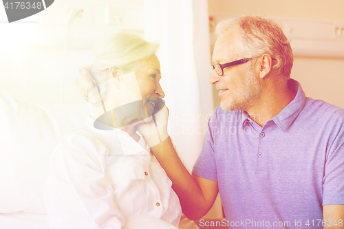 Image of senior couple meeting at hospital ward