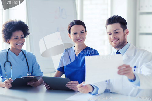 Image of group of happy doctors meeting at hospital office