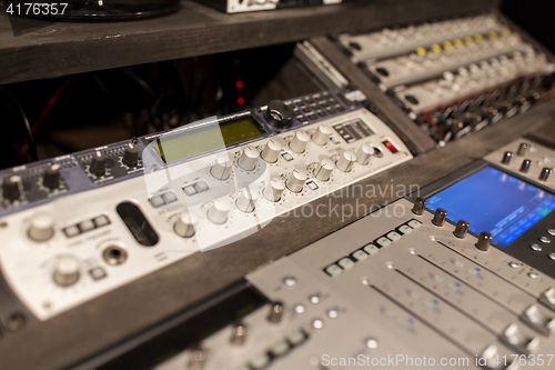 Image of music mixing console at sound recording studio