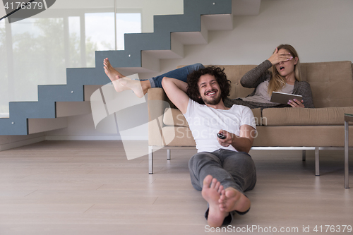 Image of young couple relaxes in the living room