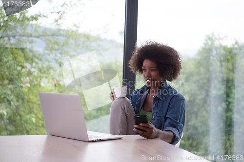 Image of African American woman in the living room